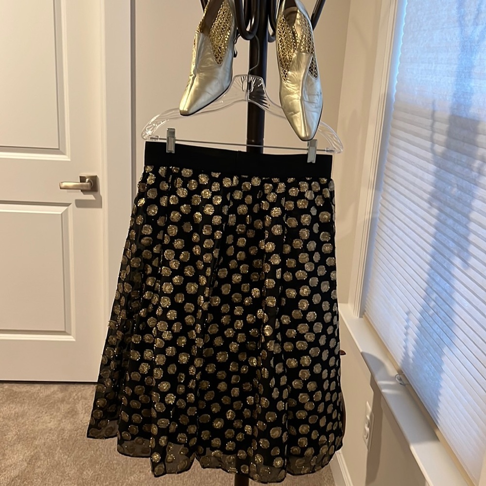 Black shirt with gold shimmery circled